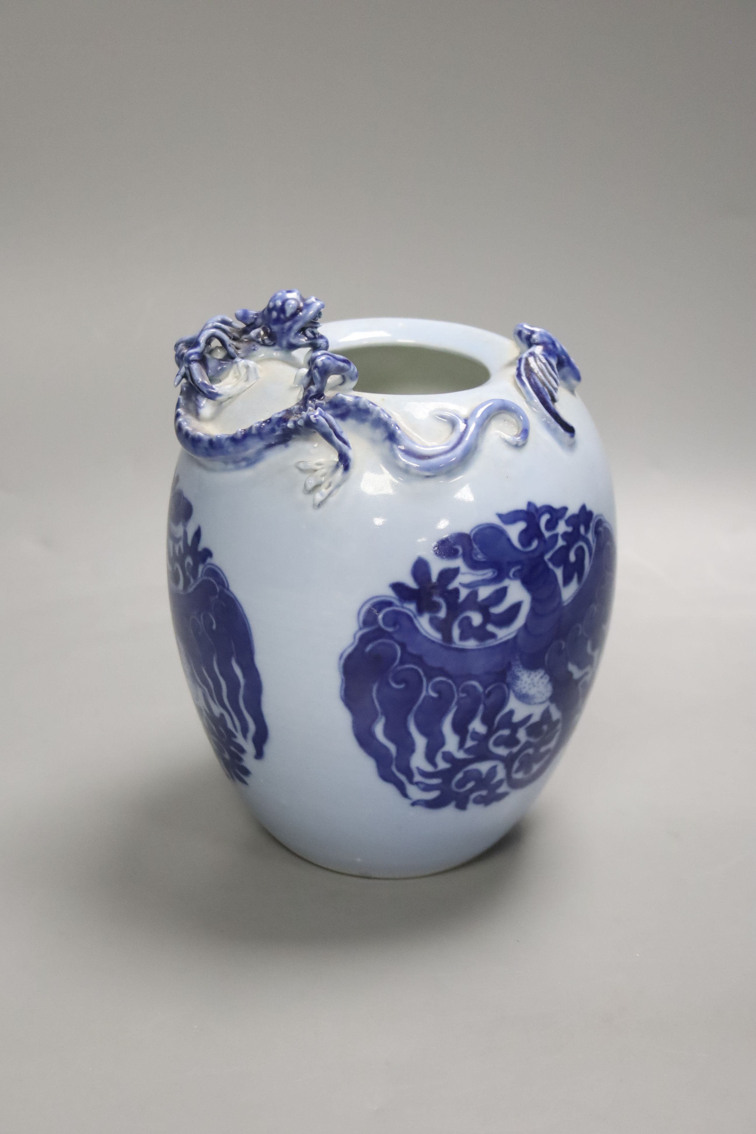 A Chinese blue ground blue and white dragon design vase, 17cm high